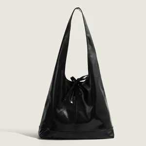 Black PU leather shoulder bag for women, large capacity minimalist casual underarm tote bag.