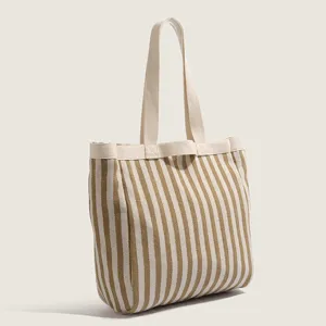Casual striped canvas tote bag for women, large capacity shoulder handbag for daily commute.