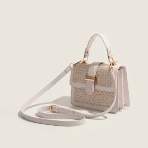 Chic straw woven square handbag for women, casual summer crossbody and shoulder bag design.
