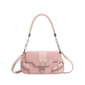 Stylish pink shoulder bag for women, featuring diamond quilting and metallic lock.
