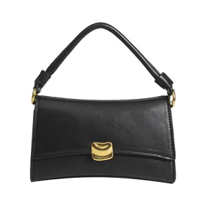 Black shoulder baguette bag for women, stylish urban handbag with chic curved design.