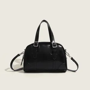 Black vintage style PU leather pillow handbag with top handles and adjustable shoulder strap.