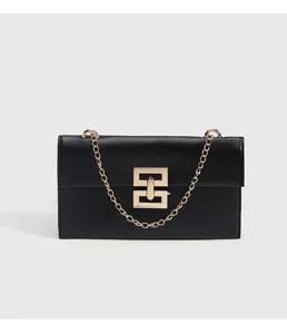Chic black leather crossbody shoulder bag with luxurious gold chain and metal lock for daily commuting.