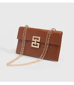 Chic women brown crossbody bag stylish small square shoulder bag with golden chain strap.