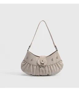 Chic beige ruched shoulder bag with silver star charms, trendy underarm bag for women.