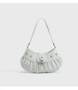 Mint green ruched shoulder bag detail, Y2K style star charm accessory, elegant design.