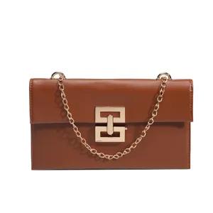 Brown leather shoulder bag women chic crossbody bag with golden chain and stylish lock.