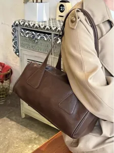 Retro brown shoulder bag for women, casual PU leather baguette bag, large capacity daily commuter.