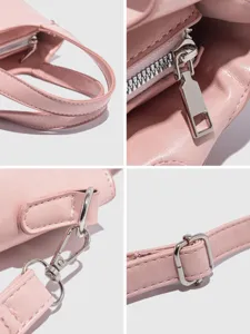 Detailed close-up views of pink women handbag hardware, fine stitching and smooth zipper.