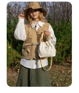 Japanese literary quilted canvas shoulder crossbody camera bag with drawstring closure.