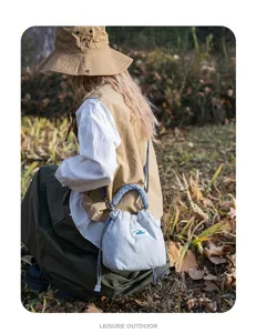 Japanese vintage style padded mirrorless camera bag, lifestyle detail view showing design.