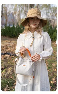 Japanese quilted mirrorless camera bag, chic canvas crossbody bag for stylish women.