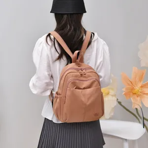 Stylish casual nylon backpack for women, lightweight multi-pocket travel school bag.