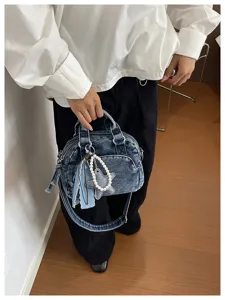 Stylish denim Boston handbag for women, casual crossbody bag with pearl star charm and tassel.