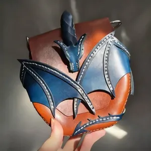 Vintage leather dragon crossbody bag with fantasy blue wings design for magical style lovers.