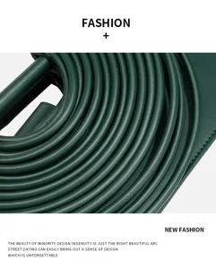 Dark green leather tubular pleated handbag detail, minimalist French retro design chic purse.