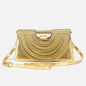 Gold metallic structured handbag with unique pleated arch handle design for women stylish crossbody.
