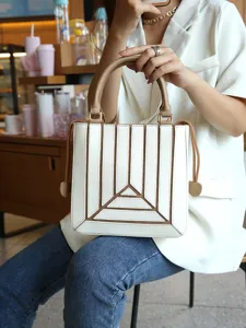 Chic white and brown spliced structured handbag, trendy shoulder crossbody bag for women.
