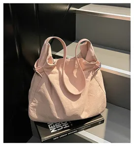 Minimalist pink nylon tote bag, casual daily shoulder bag for women commuting and travel.