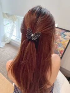 Detail view of sparkly mesh butterfly hair scrunchie with elegant rhinestone details.