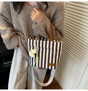 Brown white striped canvas tote bag with top handles and shoulder strap for daily use