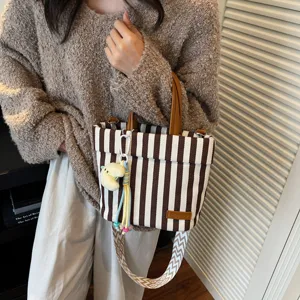 Striped canvas tote bag commuter casual shoulder handbag with top handle and stylish strap.