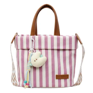 Pink white striped canvas tote bag with brown handles and shoulder strap for daily commuting.