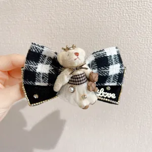 Korean style black and white plaid bow hair clip with cute crown bear and rhinestone details for women.