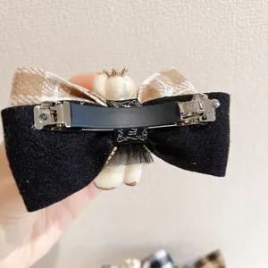 Korean plaid bow hair clip with cute plush bear and metal spring barrette for women and girls.