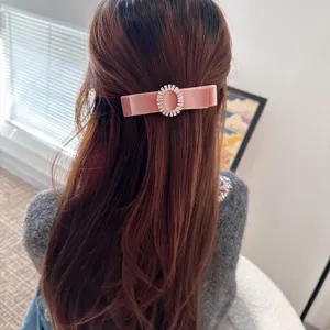 Elegant pink velvet hair clip for women with sparkling rhinestone oval buckle spring design