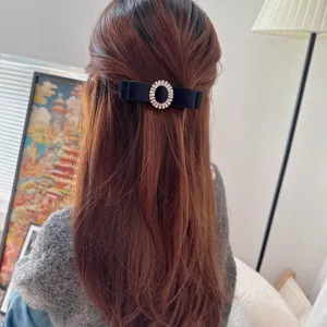 Velvet bow hair clip with sparkling rhinestone ring detail, elegant back hair barrette.