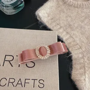 Retro pink velvet bow hair clip with sparkling rhinestone oval buckle for women fashion.