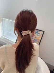 Detailed view of a Korean style sheer polka dot hair scrunchie, elegant vintage hair tie.