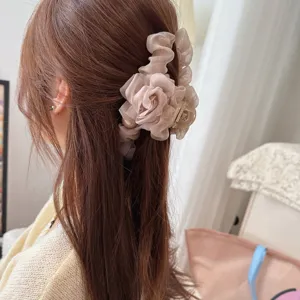 Chiffon flower hair claw clip with delicate ruffles and pearl detail for elegant hairstyles.