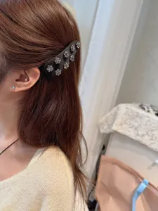 Black satin rhinestone flower hair clip, elegant side BB clip for women's hair styling.