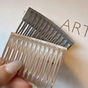 Detailed close-up of stylish Korean acrylic hair combs, featuring dual-color insert design.