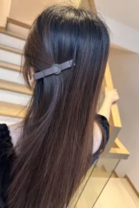 Elegant dark brown fabric bow hair clip with rhinestone ring detail for women and girls.