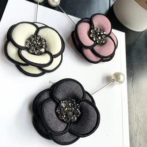 Elegant autumn winter retro camellia brooch pins with sparkly rhinestones and pearls.