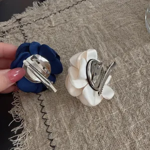 Fabric camellia flower brooch and hair clip set, dual-use pin and clip, elegant floral hair accessory for women.