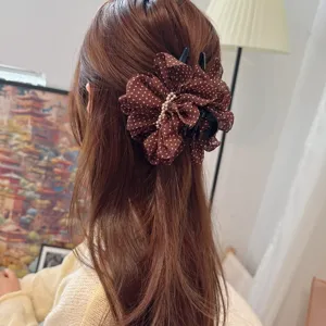 Brown polka dot mesh hair claw clip with pearl decor, elegant retro hair accessory for women.