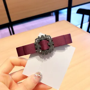 Burgundy fabric hair bow clip with sparkling crystal rhinestone round buckle for women elegant.
