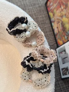 Detailed close-up of Korean mesh polka dot hair scrunchies with elegant pearl accents for daily use.