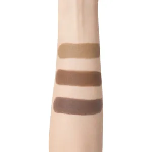 Détail du swatch de maquillage crème stick contour trois couleurs sur bras mat brun.