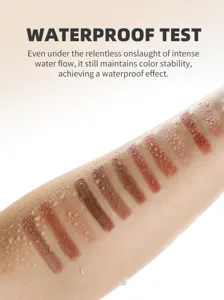 Closeup eyeshadow stick arm swatch showing waterproof effect with water droplets and rich colors.