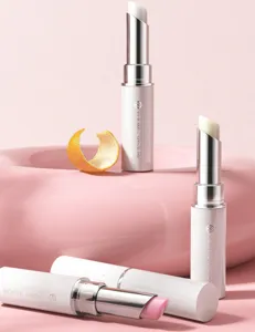 Close-up detail of moisturizing color-changing lip balm white tube packaging and glossy finish.