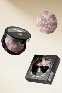 Close-up detail of the marbled baked powder compact showing smooth four-color texture.