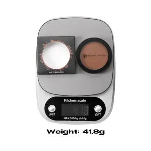 Matte bronzer powder compact detail shot on scale, ideal for contouring and face makeup.