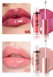 Lip gloss detail view showing glossy liquid texture and applicator brush for makeup application.