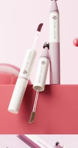 Close-up detail of dual-ended liquid blush and freckle pen applicator tip and brush.