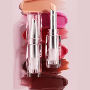 Close-up view of moisturizing lipstick tube with creamy texture and rich color swatches behind.